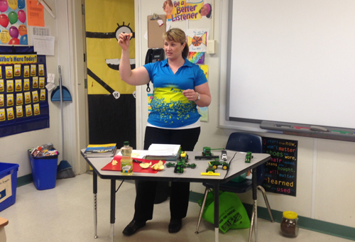 Karla Bergstrom helping kids understand canola as part of the Classroom in Agriculture Program